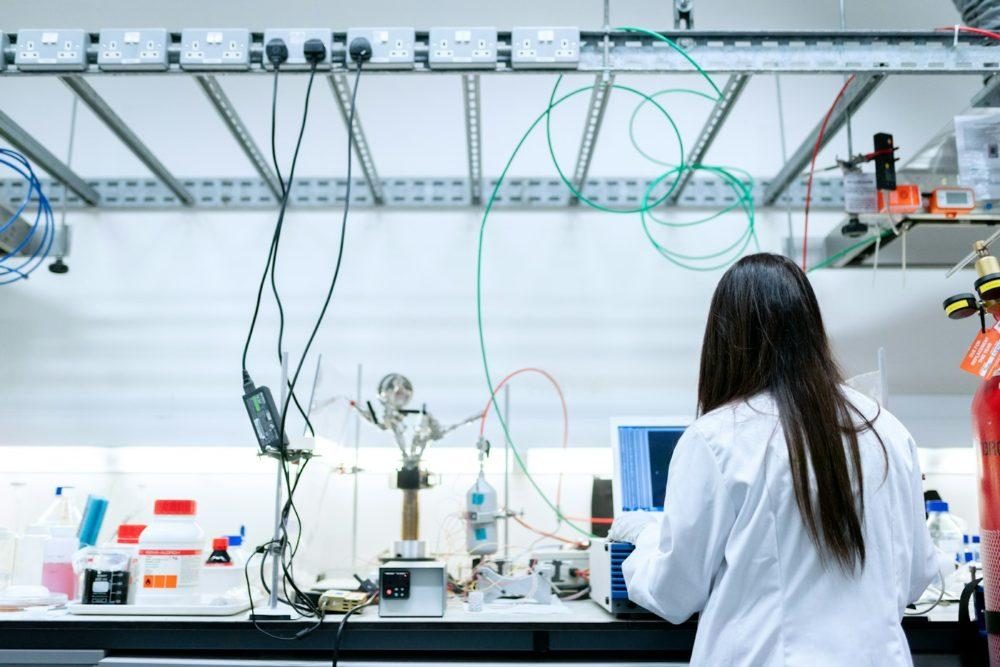 Scientist working at a laptop in a laboratory