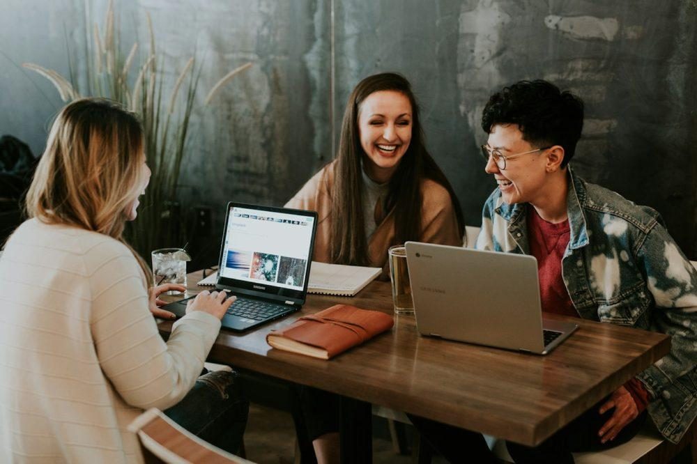 Colleagues talking around a table