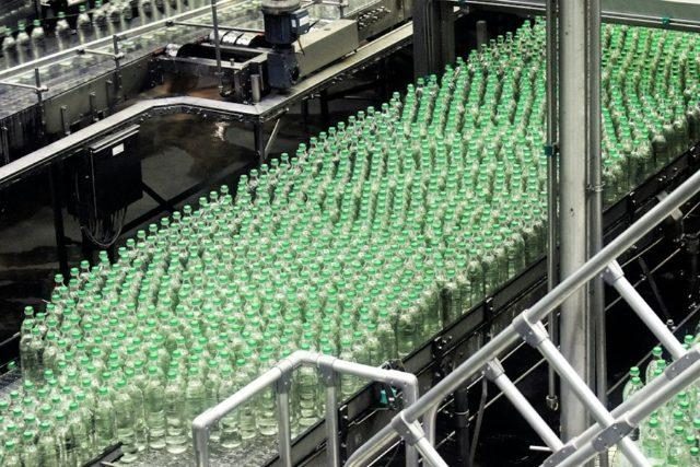 Glass bottles moving along a bottling line